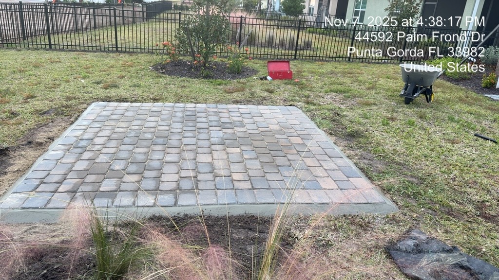 Finished square paver patio with concrete border